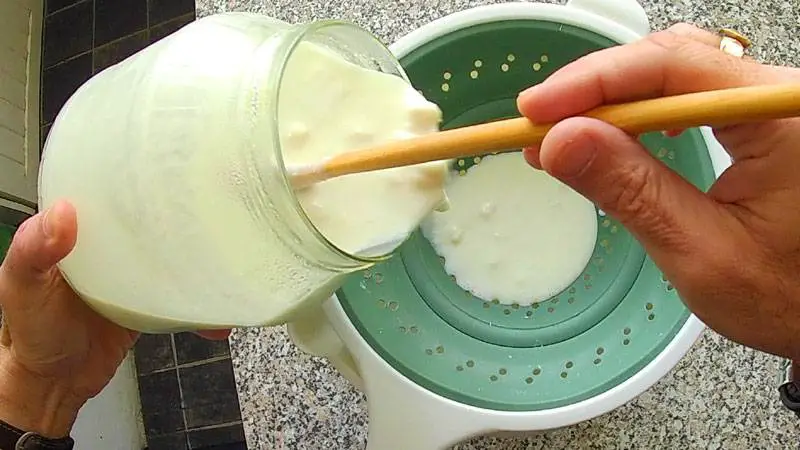 Pour the kefir through a non-metal strainer