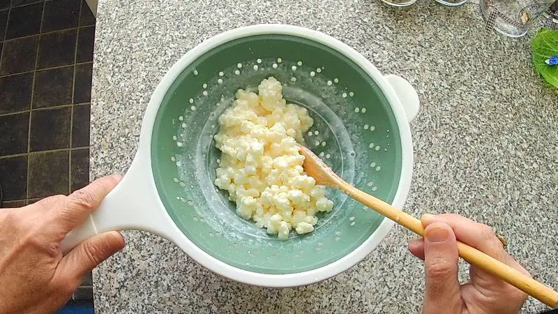 Help the liquid get through with a wooden spoon
